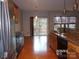 Kitchen with stainless steel appliances and access to backyard at 10244 Blakeney Preserve Dr, Charlotte, NC 28277