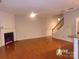 Spacious living room with hardwood floors, a fireplace, and abundant natural light at 10244 Blakeney Preserve Dr, Charlotte, NC 28277