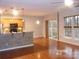 Open-concept living space with kitchen, dining, and sliding doors at 10244 Blakeney Preserve Dr, Charlotte, NC 28277