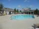 Community swimming pool area with plenty of seating, sunbathing deck, and neighborhood clubhouse at 10244 Blakeney Preserve Dr, Charlotte, NC 28277