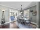 Dining room with glass-top table and kitchen view at 104 E Main St, Cleveland, NC 27013