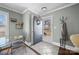 Inviting entryway with tiled floor and coat rack at 104 E Main St, Cleveland, NC 27013