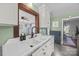 Kitchen with white cabinets, farmhouse sink, and wood countertop at 104 E Main St, Cleveland, NC 27013