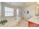 Relaxing bathroom with soaking tub, shower, and updated vanity at 1117 Butterburr Dr, Matthews, NC 28104