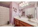 Bathroom with a vanity, shower, and ruffled shower curtain at 1117 Butterburr Dr, Matthews, NC 28104