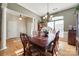 Formal dining room with hardwood floors and large windows at 1117 Butterburr Dr, Matthews, NC 28104