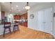 Kitchen with hardwood floors, dark wood cabinets, and stainless steel appliances at 1117 Butterburr Dr, Matthews, NC 28104