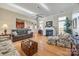 Living room with fireplace and hardwood floors at 1117 Butterburr Dr, Matthews, NC 28104