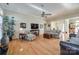 Spacious living room with hardwood floors, a ceiling fan, and comfortable furniture at 1117 Butterburr Dr, Matthews, NC 28104