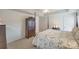 Main bedroom with a four-poster bed, wooden dresser, and closet at 1117 Butterburr Dr, Matthews, NC 28104