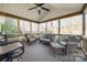 Enjoy this relaxing screened porch with seating area at 1117 Butterburr Dr, Matthews, NC 28104