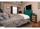 Bedroom with a queen bed and teal dresser at 115 Tradewinds Ct, Mooresville, NC 28115