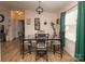 Bright dining room with a glass-top table and four chairs at 115 Tradewinds Ct, Mooresville, NC 28115