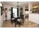 Bright dining room with a glass-top table and four chairs at 115 Tradewinds Ct, Mooresville, NC 28115