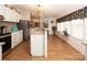 Modern kitchen with an island, granite countertops, and white cabinets at 115 Tradewinds Ct, Mooresville, NC 28115