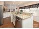 Kitchen island with granite countertop and breakfast bar seating area at 115 Tradewinds Ct, Mooresville, NC 28115