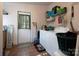 Laundry room with washer, dryer, and storage shelves at 115 Tradewinds Ct, Mooresville, NC 28115