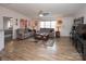 Comfortable living room with neutral colored couches and hardwood floors at 115 Tradewinds Ct, Mooresville, NC 28115