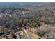 Aerial view showing house location and surrounding wooded area at 133 Devine St, Stanley, NC 28164