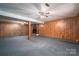 Spacious basement with fireplace and wood paneling at 133 Devine St, Stanley, NC 28164