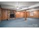 Finished basement with brick fireplace and wood paneling at 133 Devine St, Stanley, NC 28164