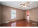 Spacious bedroom with wood floors and ceiling fan at 133 Devine St, Stanley, NC 28164