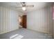 Small bedroom with carpet flooring and striped wallpaper at 133 Devine St, Stanley, NC 28164