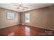 Spacious bedroom with hardwood floors and large windows at 133 Devine St, Stanley, NC 28164