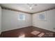 Well-lit bedroom with wood floors and two windows at 133 Devine St, Stanley, NC 28164