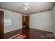 Bright bedroom with wood floors and ceiling fan at 133 Devine St, Stanley, NC 28164