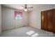 Bright bedroom featuring carpet, window, and built-in closet at 133 Devine St, Stanley, NC 28164