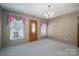 Bright dining room with wood floors and entryway at 133 Devine St, Stanley, NC 28164