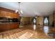 Dining room with hardwood floors and access to kitchen at 133 Devine St, Stanley, NC 28164