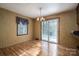 Dining area with hardwood floors and sliding glass doors at 133 Devine St, Stanley, NC 28164