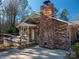 Brick home with a covered porch and a deck at 133 Devine St, Stanley, NC 28164