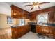 Kitchen with wood cabinets, granite counters, and black appliances at 133 Devine St, Stanley, NC 28164