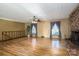 Spacious living room with hardwood floors and a fireplace at 133 Devine St, Stanley, NC 28164