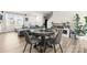 Bright dining area with a round table and four gray chairs at 139 Crownpiece St, Troutman, NC 28166