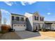 Two-story house with gray siding, white garage door, and landscaping at 139 Crownpiece St, Troutman, NC 28166