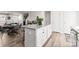 Kitchen island with granite countertop and white shaker cabinets at 139 Crownpiece St, Troutman, NC 28166