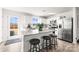 Modern kitchen with granite island, stainless steel appliances, and white cabinets at 139 Crownpiece St, Troutman, NC 28166