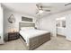 Bright main bedroom with king bed, ceiling fan, and en-suite access at 139 Crownpiece St, Troutman, NC 28166