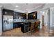 Basement kitchen with island and stainless steel appliances at 19107 Wildcat Trl, Davidson, NC 28036