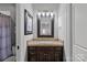 Bathroom with vanity, sink, and shower at 19107 Wildcat Trl, Davidson, NC 28036