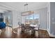 Bright dining room with lake views and a rustic wooden table at 19107 Wildcat Trl, Davidson, NC 28036