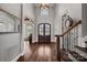 Grand entryway with hardwood floors and elegant staircase at 19107 Wildcat Trl, Davidson, NC 28036