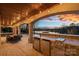 Outdoor kitchen and patio with sunset views at 19107 Wildcat Trl, Davidson, NC 28036