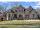 Brick and stone home with a welcoming front entrance at 19107 Wildcat Trl, Davidson, NC 28036