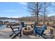 Fire pit with Adirondack chairs and scenic lake views at 19107 Wildcat Trl, Davidson, NC 28036