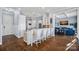 Kitchen island with seating overlooks the living room at 19107 Wildcat Trl, Davidson, NC 28036